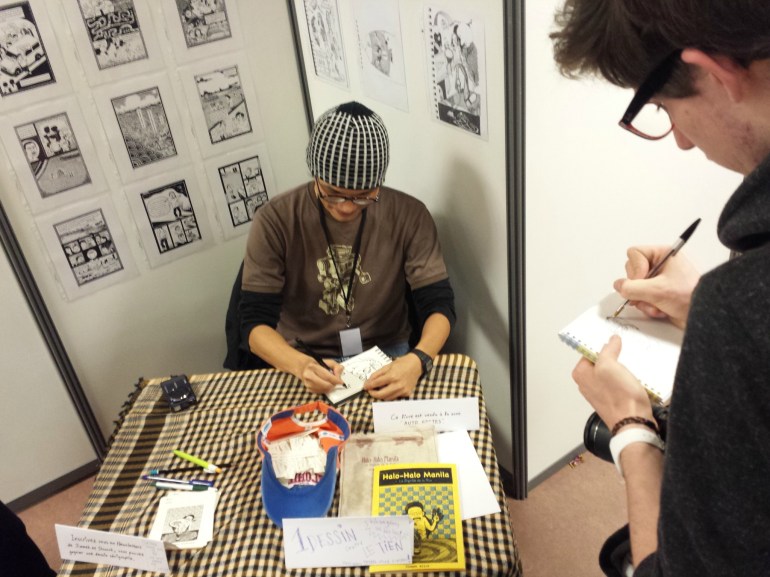 Un portrait contre un portrait ! Jimmeh Aitch croquant et croqué sur son stand